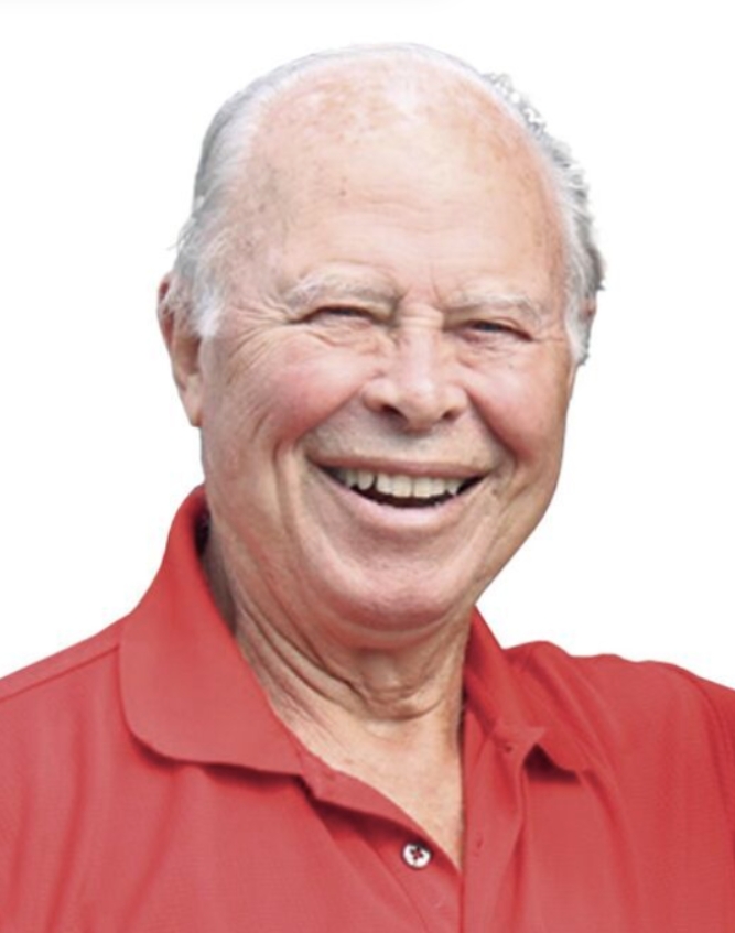 Image of a smiling white male in a red shirt.